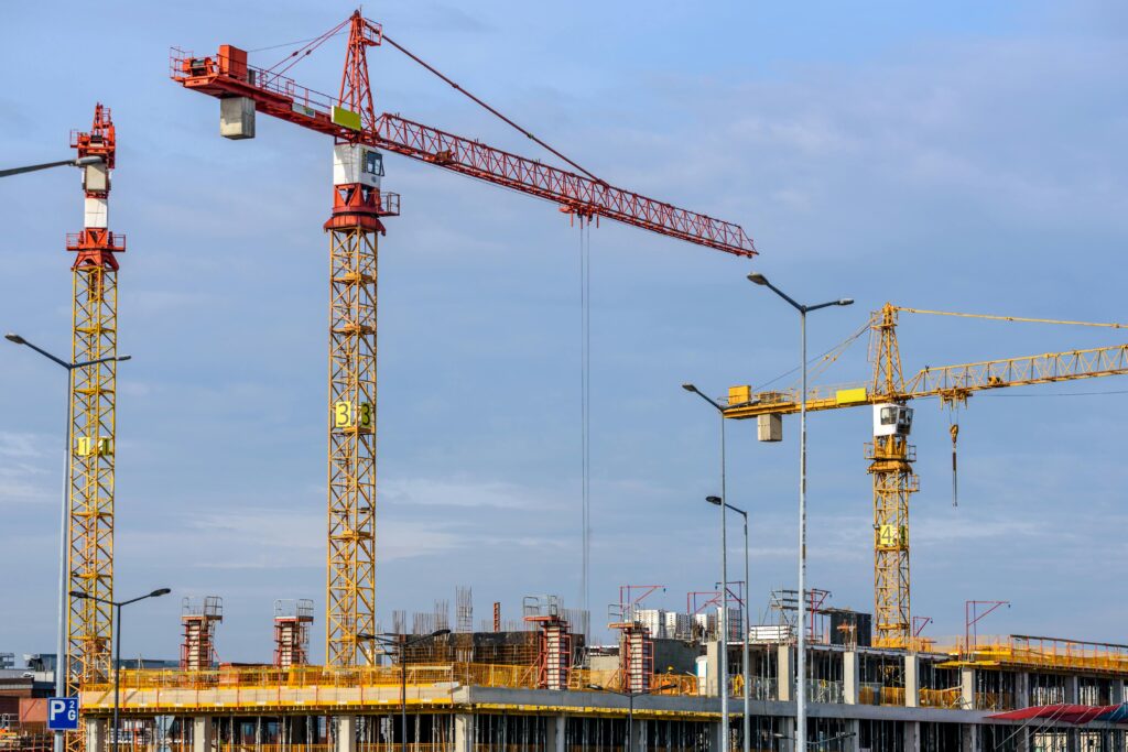 Crane machinery at construction site, AS Photography.